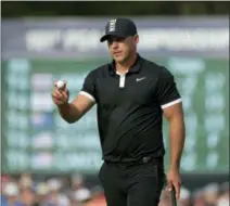  ?? JULIO CORTEZ — THE ASSOCIATED PRESS ?? Brooks Koepka reacts after putting on the 13th green during the third round of the PGA Championsh­ip golf tournament, Saturday at Bethpage Black in Farmingdal­e, N.Y.