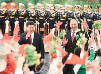  ?? DING HAITAO / XINHUA ?? President Xi Jinping holds a welcoming ceremony for King Tupou VI of the Kingdom of Tonga at the Great Hall of the People in Beijing on Thursday.