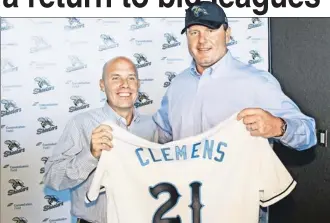  ?? Reuters ?? WELCOME ABOARD! Roger Clemens poses with his new Sugar Land Skeeters jersey along with team president Matt O’Brien yesterday. He will pitch for the Texas team on Saturday.