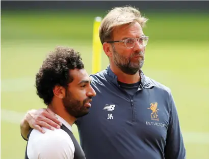  ?? Reuters ?? Liverpool manager Juergen Klopp and Mohamed Salah during a training session. —