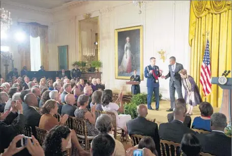  ?? Andrew Harnik ?? PRESIDENT OBAMA gives a National Humanities Medal to Berkeley chef Alice Waters. “I think Alice said she’s going to cook me something,” he told the audience. Sally Field, Stephen King and several California­ns were among those honored for cultural...