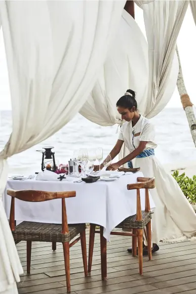  ??  ?? The table is set for Anantara’s private dining on the beach