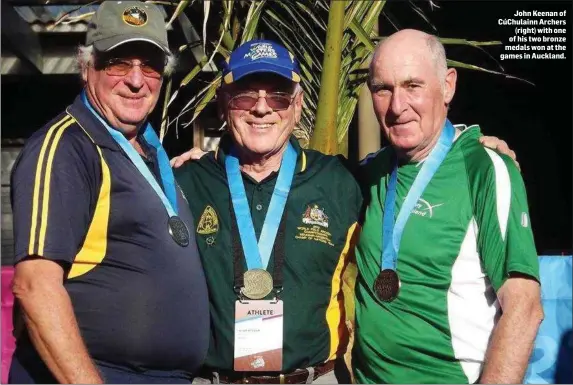  ??  ?? John Keenan of CúChulainn Archers (right) with one of his two bronze medals won at the games in Auckland.