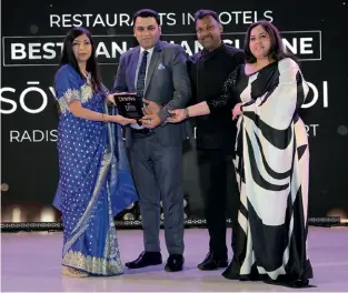  ?? ?? Anuj Soin, director operations, chef Sreenivasa­n, culinary director, Simmi Sood, director PR & marketing, Radisson Blu Plaza, New Delhi receive the award for Neung Roi, the winner of Best Pan Asian Cuisine.