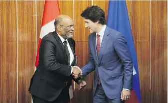  ?? SEAN KILPATRICK, THE CANADIAN PRESS ?? Prime Minister Justin Trudeau takes part in a bilateral meeting with Prime Minister Ariel Henry of Haiti during the Conference of Heads of Government of the Caribbean Community in Nassau, Bahamas, on Thursday.