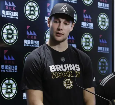  ?? ASSOCIATED PRESS ?? IT’S SETTLED: Brandon Carlo speaks to the media yesterday at Warrior Ice Arena after signing a two-year contract with the Bruins worth an average annual value of $2.85 million.