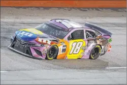 ?? Brynn Anderson The Associated Press ?? Kyle Busch, driving No. 18, unintentio­nally caused a crash Wednesday night with Chase Elliott, sparking what could be NASCAR’S next heated driver feud.