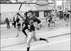  ?? /PHOTO PROVIDED BY JEFF MESCAL ?? Jeff Mescal runs in the Toronto Waterfront Marathon in a Cubs uniform on Oct. 20. The Hebron resident set a Guinness World Record for the fastest marathon time in a baseball uniform.