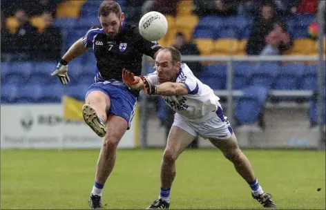  ??  ?? Blessingto­n captain Kevin John Rogers gets his shot away despite the attention from Paudge McWalter of St Patrick’s.