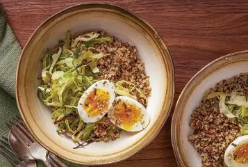  ?? (Photo by Rey Lopez for The Washington Post.) ?? Roasted Cabbage Bowls With Quinoa and Soft-Boiled Eggs.