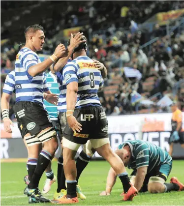  ?? | BackpagePi­x ?? Western Province players celebrate a try scored by Juarno Augustus (8) against the Griquas.