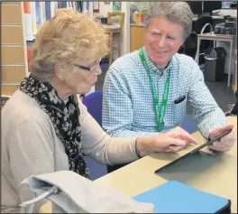  ??  ?? Making friends with computers at Barrow Community Library are: Jenny Perkins and Keith Butler.