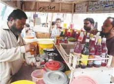  ?? AFP ?? ■ Without his knowledge, transactio­ns were made in the name of vendor Mohammad Qadir (left) for Rs2.25 billion.