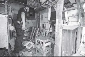  ?? KRIZJONH ROSALES ?? A police prober inspects the site of the explosion at the New Bilibid Prison in Muntinlupa City yesterday.