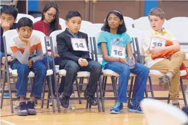  ?? MARLA BROSE/JOURNAL ?? From left, Dhruv Grandhe, a fifth-grader from Albuquerqu­e, Samuel Le, a fifth-grader from Rio Rancho, Akansha Nanda, a sixth-grader from Santa Fe, and Lucas Robbins, a fifth-grader from Santa Fe, wait for their turn to spell during during the New...