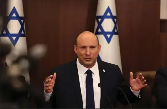  ?? AP FILE ?? CALMING COMMENT: Israeli Prime Minister Naftali Bennett speaks during a weekly cabinet meeting in Jerusalem on Sunday,. Bennett says he accepted an apology from Russian President Vladimir Putin for controvers­ial remarks about the Holocaust made by Moscow’s top diplomat.