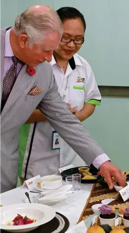  ??  ?? Royal approval: Charles inspects superfoods in Malaysia