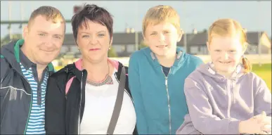  ??  ?? Ronan and Elaine Smith with their children, Luke and Aoife, at the Pettitt’s gala race night.