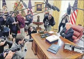  ?? Chip Somodevill­a Getty Images ?? FILERS who didn’t adjust their W-4s may have taken home more in 2018 but now won’t get the refund they expected. Above, President Trump after signing the law.