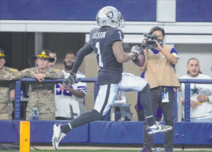  ?? Heidi Fang Las Vegas Review-journal @Heidifang ?? Raiders wide receiver Desean Jackson scores a 56-yard touchdown during an overtime victory over the Cowboys on Thursday. He totaled three catches for 102 yards.