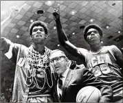  ?? AP 1969 ?? Kareem Abdul-Jabbar (left, then known as Lew Alcindor with UCLA coach John Wooden and Sidney Wicks) became more outspoken as he got older.