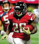  ?? SCOTT CUNNINGHAM/ GETTY IMAGES ?? Third-year running back Tevin Coleman tied his career high with 20 carries in Sunday’s victory over Dallas.