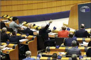  ?? (AP/Geert Vanden Wijngaert) ?? Members of European Parliament participat­e in a series of votes as they attend a plenary session at the European Parliament in Brussels on Wednesday.