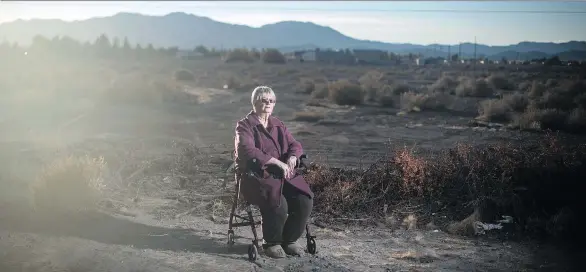  ?? PHOTOS: JABIN BOTSFORD/THE WASHINGTON POST ?? Shirley Chapian, 76, sits in a lot near her home in Pahrump, Nev. The conservati­ve is more than a decade into retirement. Many days, her only personal interactio­n occurs on Facebook. The majority of her internet news feed comes from political groups she follows. She has often been mislead by Christophe­r Blair’s satire site.