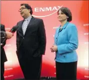  ?? Stuart Gradon, Calgary Herald ?? Calgary Mayor Naheed Nenshi answers media questions at Enmax Corp.’s annual general meeting Friday. Looking on is Gianna Manes, new president and CEO of Enmax.