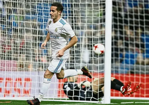  ??  ?? Wasn’t that easy?: Real Madrid’s Lucas Vazquez running off to celebrate after scoring the first goal past Numancia goalkeeper Munir Mohand Mohamedi in the Spanish King’s Cup last-16 match at the Bernabeu on Wednesday. The match ended 2-2 but Real...