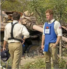  ??  ?? Prince Harry, with HALO director Guy Willougby, visits a landmine clearance charity championed by his mother.