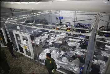  ?? DARIO LOPEZ-MILLS — THE ASSOCIATED PRESS FILE ?? Minors lie inside a pod at the Donna Department of Homeland Security holding facility in Donna, Texas.