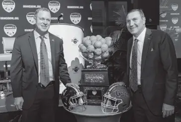 ?? MATIAS J. OCNER mocner@miamiheral­d.com ?? Virginia coach Bronco Mendenhall, left, will lead his team in its first Orange Bowl appearance. Florida coach Dan Mullen, right, is taking the Gators into their second consecutiv­e New Years Six bowl.