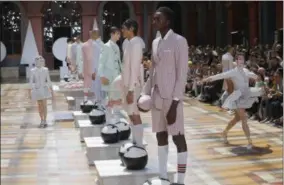  ?? MICHEL EULER - ASSOCIATED PRESS ?? Models wear creations for the Thom Browne men’s Spring-Summer 2020fashio­n collection presented in Paris on Saturday.