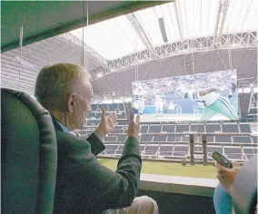  ?? DONNA MCWILLIAM/ASSOCIATED PRESST ?? Dallas Cowboys owner Jerry Jones shows the view of Cowboys Stadium, where 50 percent capacity could mean hosting up to 45,000 fans for an NFL game.