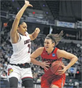  ?? DAVID JABLONSKI / STAFF ?? UD’s Andrea Hoover goes against Louisville’s Bria Smith. Hoover scored 18 of her 26 in the second half, including six in the first few minutes as UD took control.