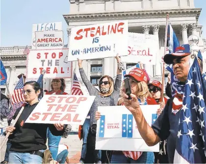  ?? SPENCERPLA­TT/GETTY ?? Dozens of people calling for stopping the vote count in Pennsylvan­ia due to alleged fraud against President Donald Trump gather on the steps of the State Capital on Nov. 5 in Harrisburg.