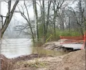  ?? / Diane Wagner ?? The swollen Oostanaula River curls under the washed out trail Sunday behind Chieftains Museum on Riverside Parkway in Rome.