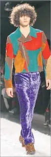  ?? Bebeto Matthews Associated Press ?? V E LV E T pants — in purple! — hit the Jeremy Scott runway.