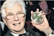  ??  ?? Godfrey with his Arts Foundation of New Zealand medal: he composed anthems, motets, carols, hymn tunes and imaginativ­e descants