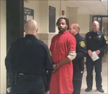  ?? CARL HESSLER JR. - DIGITAL FIRST MEDIA ?? Jonathan Wesley Harris, 31, is escorted from a Montgomery County courtroom after he pleaded not guilty at his formal arraignmen­t on charges in connection with the alleged Aug. 22 strangulat­ion death of Christina Rose Kraft, 36, inside her Ardmore residence.