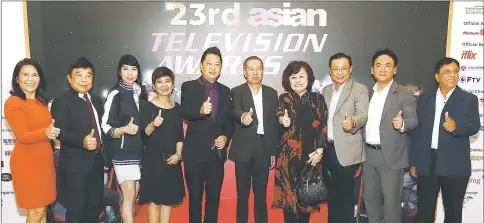  ??  ?? Kritakara (third left) joins (from left) Viola, Lam, Jimenez, Ham, as well as Hung (fourth right), Meegaswatt­e (right) and other guests in a photo-call at the lobby of Hilton Hotel Kuching. — Photo by Muhammad Rais Sanusi