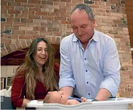  ??  ?? Barnaby Joyce and partner Vikki Campion giving their son Sebastian a bath on Channel Seven’s Sunday Night.