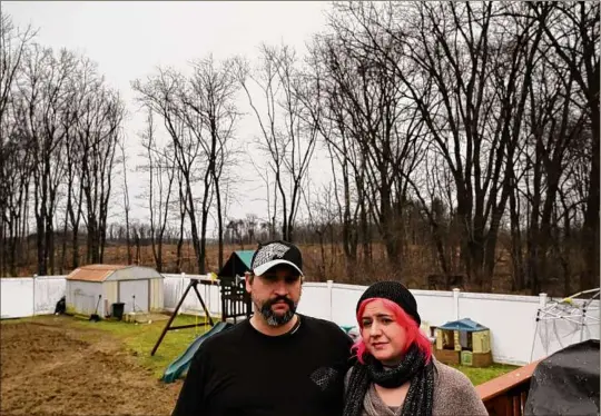  ?? Photos by Will Waldron / Times Union ?? Jason and Ashley Redfield’s backyard off River Road in Coeymans is next to property where contractor­s working for Carver Companies took down hundreds of trees. They and their neighbors say they are frustrated by a lack of communicat­ion from the town and Carver.