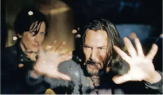  ?? ?? KEANU Reeves and Carrie-anne Moss in The Matrix Resurrecti­ons.
| WARNER BROS
