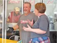  ?? STAFF FILE PHOTO ?? Charlie’s BBQ & Bakery owners Wes Agee and Elizabeth St. Clair talk at the restaurant in March 2019.