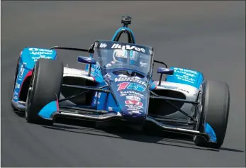  ?? ?? The Associated Press
Graham Rahal drives through the first turn during qualificat­ions for the Indianapol­is 500 auto race at Indianapol­is Motor Speedway in Indianapol­is, Saturday.