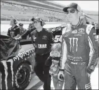  ?? AP/NICK WASS ?? Kurt Busch (right), seen before last week’s NASCAR Nationwide event in Dover, Del., was absent Friday at Pocono Raceway as part of the one-week suspension levied against him for verbally abusing a media member. Busch is not eligible to return to a...