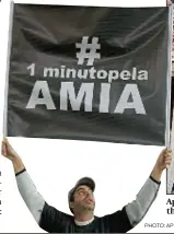  ?? PHOTO: AP ?? Aprotester at the Argentina-Iran match ( and (above) the aftermath of the 1994 car bomb attack on the Amia Jewish centre in Buenos Aires