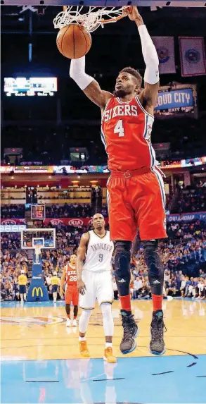  ?? [PHOTO BY SARAH PHIPPS, THE OKLAHOMAN] ?? Nerlens Noel, then with Philadelph­ia, dunks during a 2015 game at Chesapeake Energy Arena. Noel signed a two-year contract with Oklahoma City on Monday.